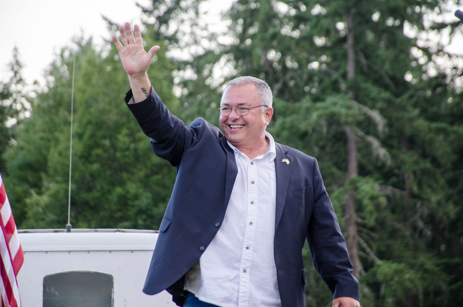 Loren Culp waves to the crowd during a rally in Yelm in July. 