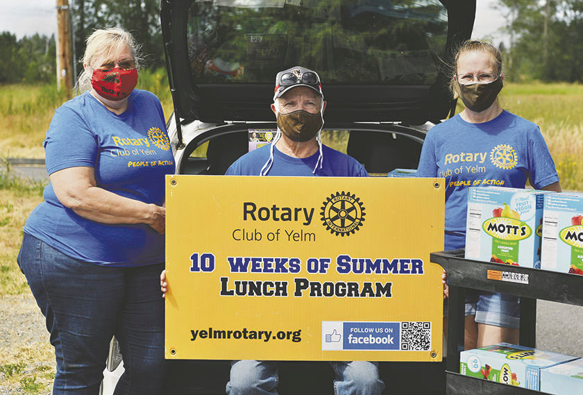 L-R: Rotary Club of Yelm members Sandi Hanson, Larry Hanson, and Kathy Kruize bought food on Friday, July 10, for the club's "10 Weeks of Summer" feeding program and stopped at the Yelm Senior Center to unload it.