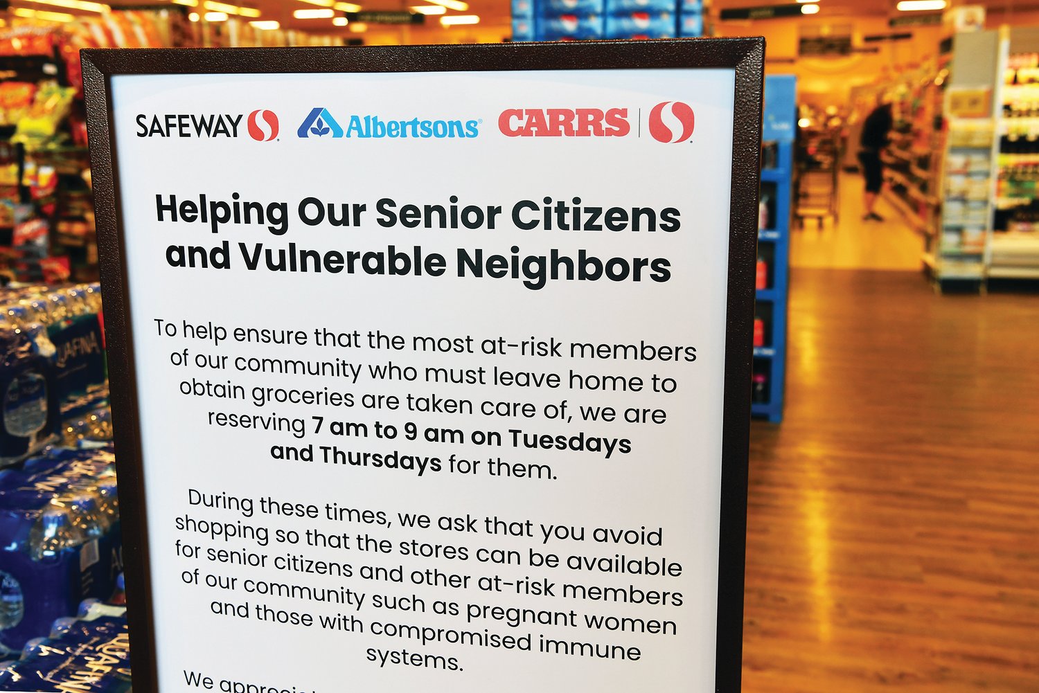 A sign on March 23 near the entrance to Yelm Safeway tells another tale of COVID-19, this one to help shield seniors and other at-risk shoppers from crowds that could pass on the virus.