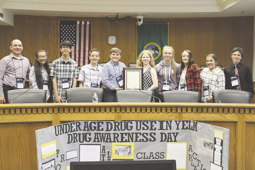from left, Cody Colt, Angela Renteria, Benicio Castaneda, Ben Carney, Nathan Fitch, Toria Pangborn, Ava Hyder, Kylie Taylor, Gabrielle Hollenbeck and Isaiah Olinger show off their project that increased drug awareness in underaged kids.