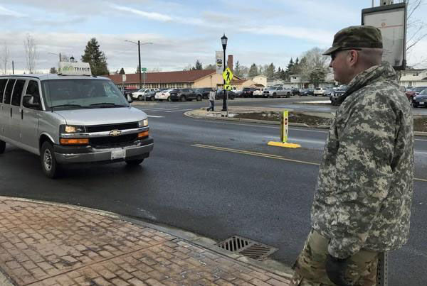 Sgt. James Morehouse boards a GO Transit van on Joint Base Lewis-McChord. Morehouse, a regular rider, said he enjoys the consistency of service provided by GO Transit to go from housing to work and to travel off-base to visit family.
