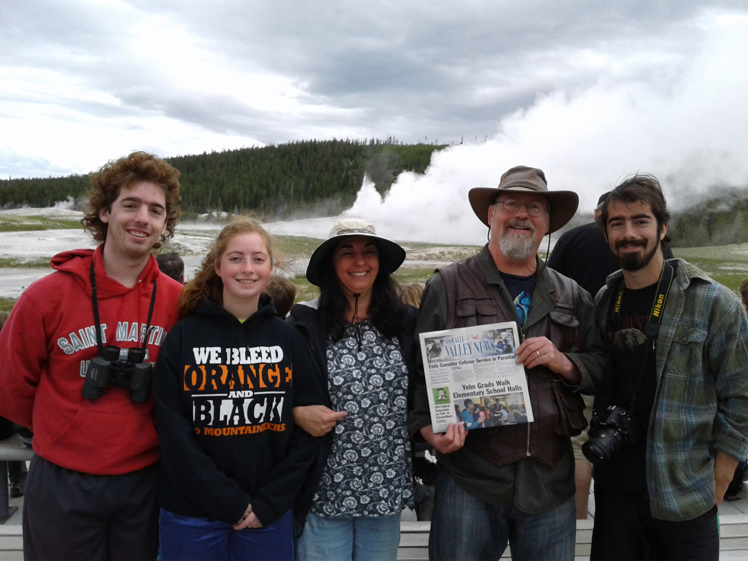The Maddox family of A Novel Bookstore in Yelm hold up a copy of the Nisqually Valley News in front of Old Faithful in Yellowstone Park. If you take a picture holding up the NVN while on vacation, send it to mwagar@yelmonline.com and the paper will print it in an upcoming edition.