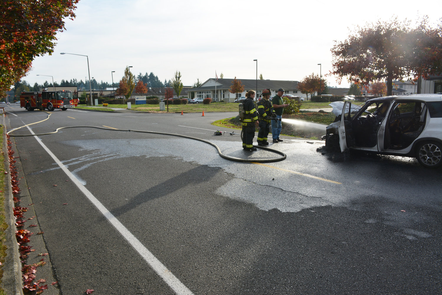 A car fire closed both lanes of traffic on Creek Street near the Yelm Post Office on Thursday.