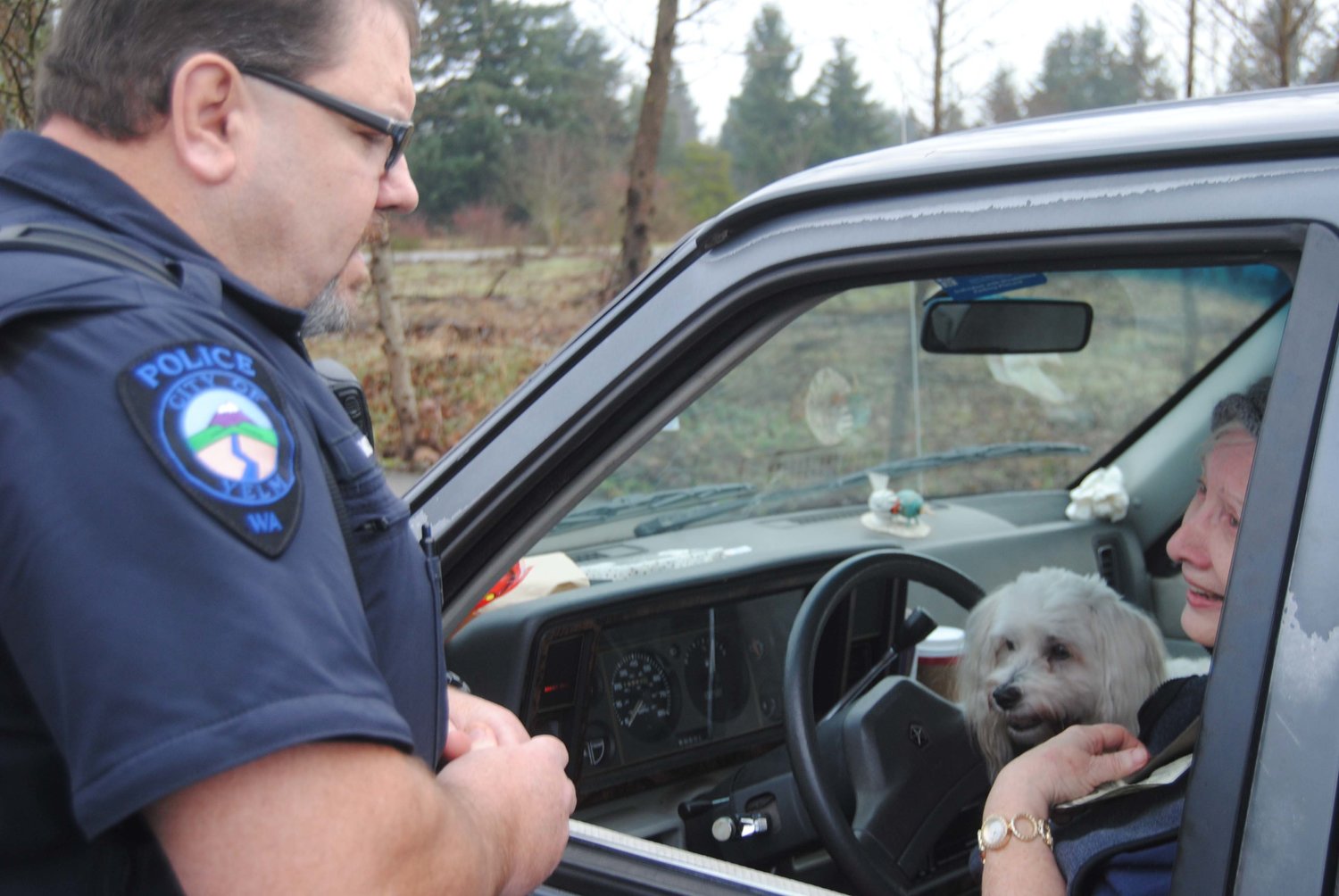 Yelm Police Officer Don Moody, after pulling over driver Elaine Kirkwood for not using a turn signal, gives her $100 instead of a ticket. It was part of a local "Secret Santa" giveaway of $5,000.