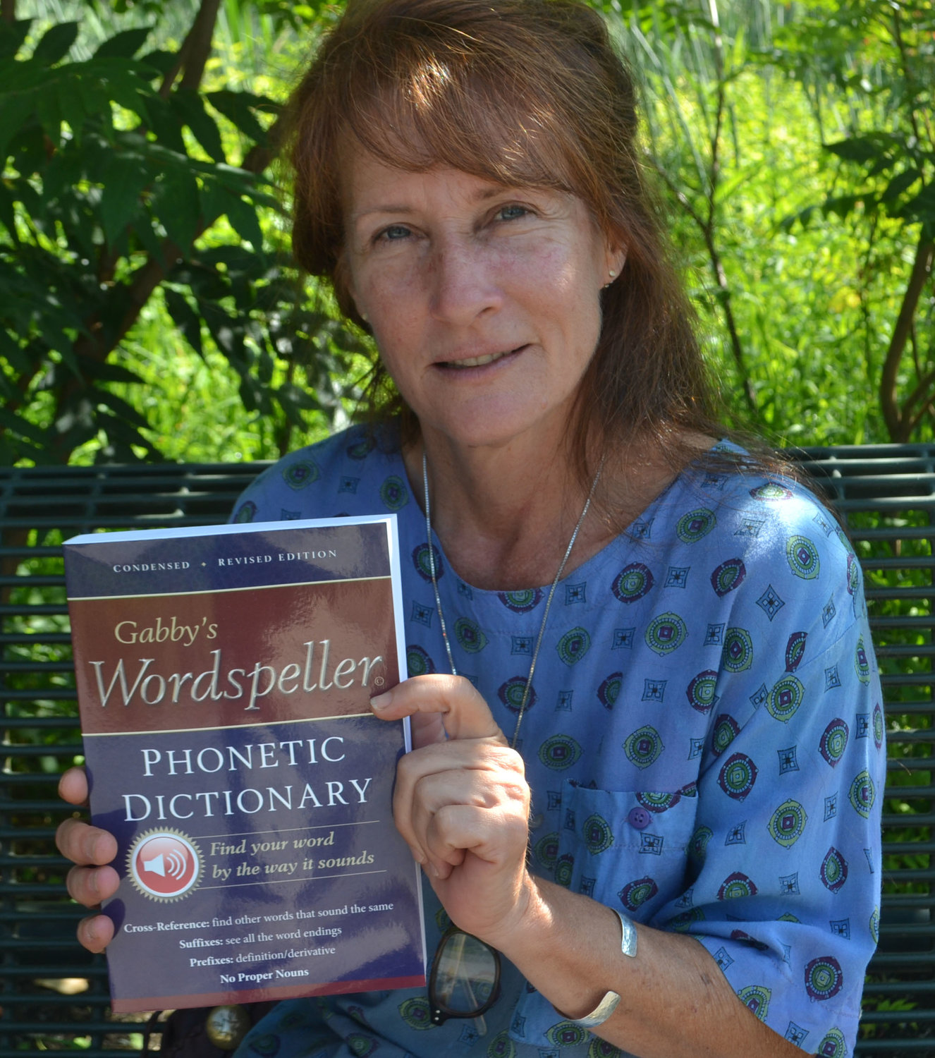 Diane Frank holds up "Gabby's Wordspeller," the phonetic dictionary she created for her daughter, who is dyslexic.