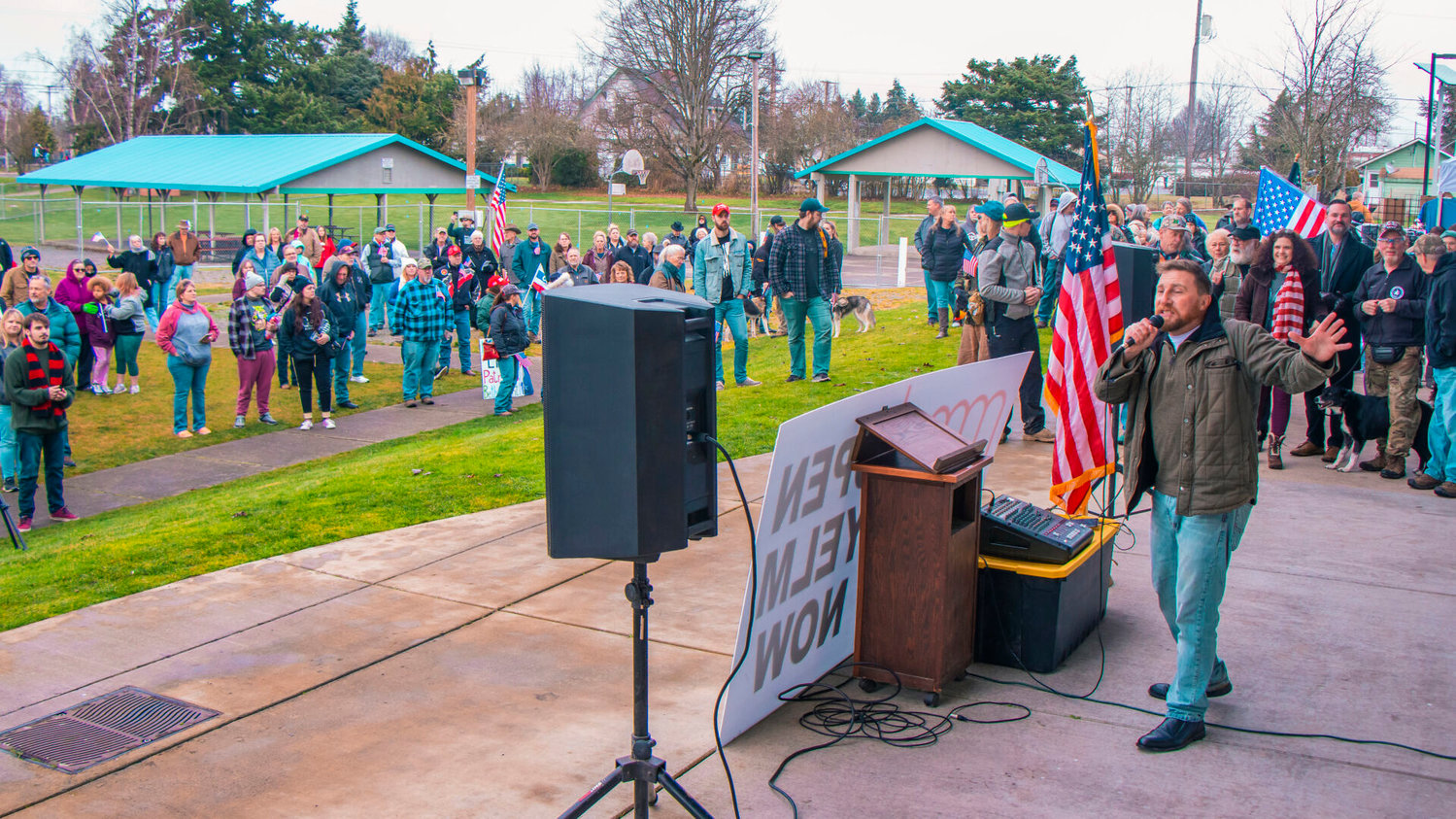 Erik Rohde, of the Washington Three Percenters, addresses crowds during an ‘Open Yelm Now’ rally at Yelm City Park.