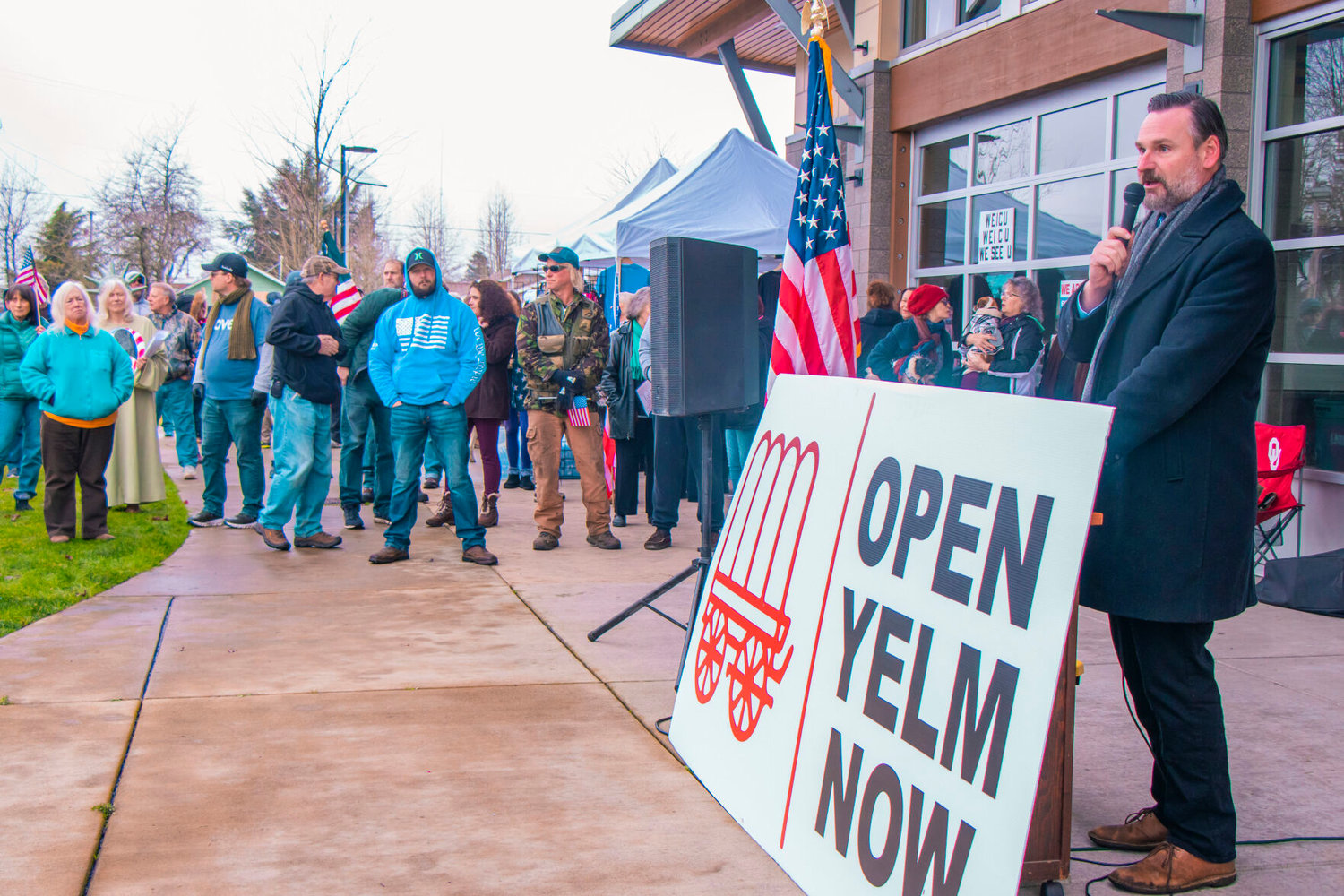 Rian Ingrim speaks to crowds during a protest to ‘Open Yelm Now’ at Yelm City Park on Saturday.