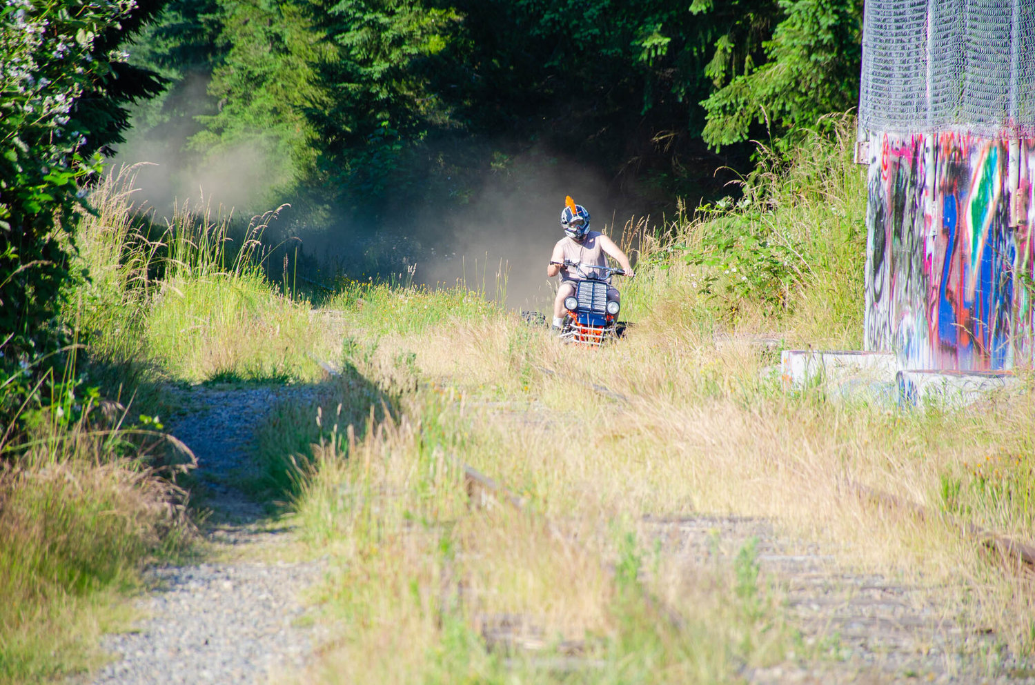 A person on a motor-vehicle is pictured on the Yelm Prairie Line Trail at the Centralia Canal on June 21.