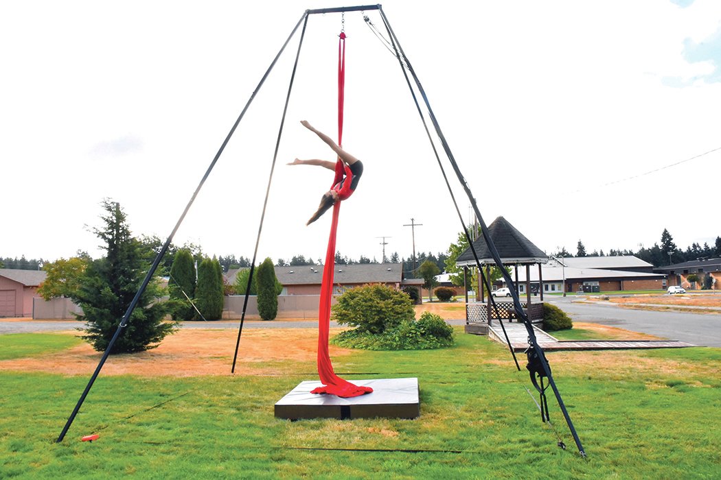 Yelmite Bailey Sowers, 15, performs on the aerial silks at a park in Rainier.
