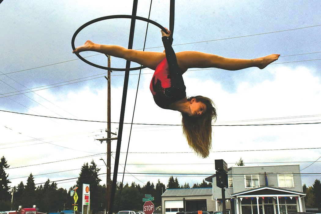 Elaina Brainard, 14, performs on the lyra, or aerial hoop.