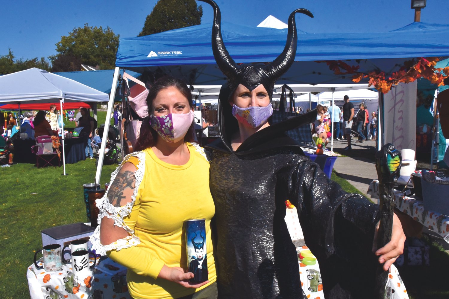 Stephanie Blose, as Maleficent, smiles with Brandy Totman at the Yelm Fall Harvest Festival on Saturday, Sept. 25 at Yelm City Park.