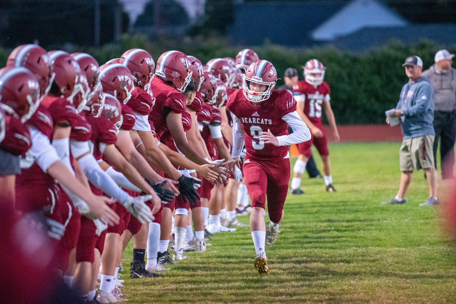 FILE PHOTO -- W.F. West quarterback Gavin Fugate (9) sprints down the sideline during pregame announcements during a home game against Rochester Oct. 8.