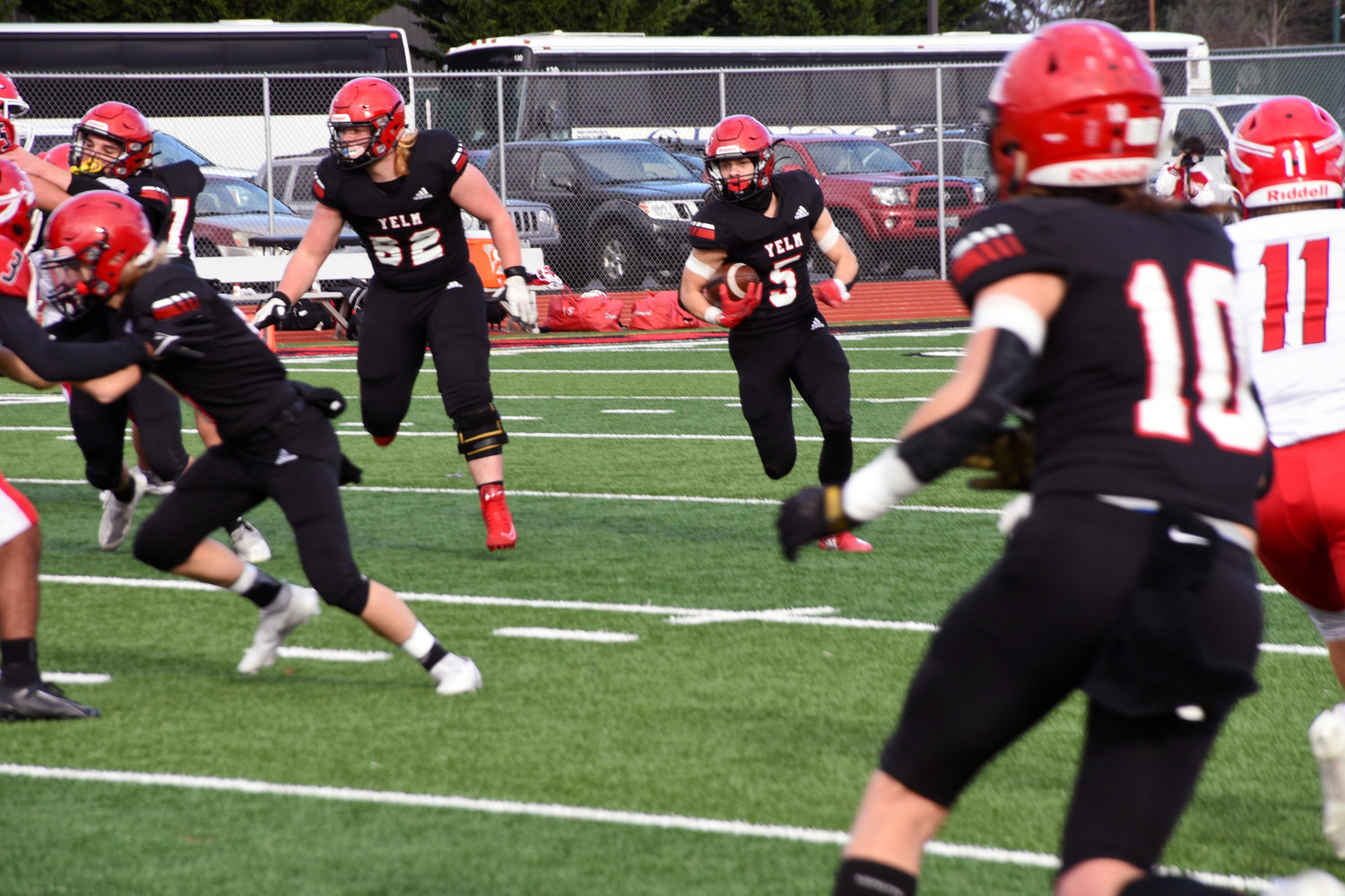 Kyler Ronquillo (#5) runs the ball for Yelm in a quarter finals game against Marysville-Pilchuck