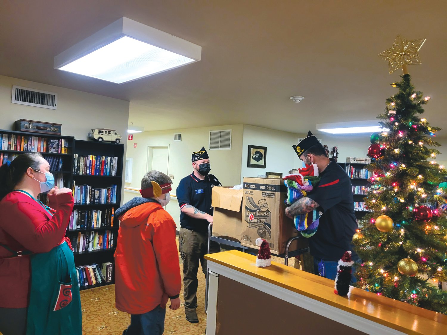 Members of the American Legion Post 164 prepare to hand out stockings to veterans on Tuesday, Dec. 21.