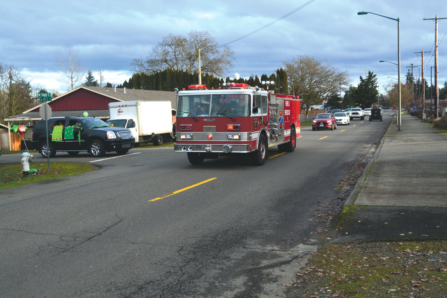 The Yelm Fire Department participates in a car parade for Jeren Pollock on Jan. 8.