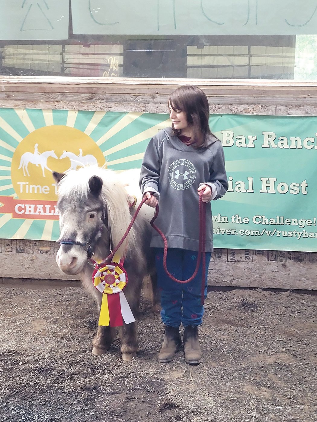 One of Kathy Richardson’s clients, 9-year-old Mackenzie Merkel, poses with Ghost, the mini-horse.