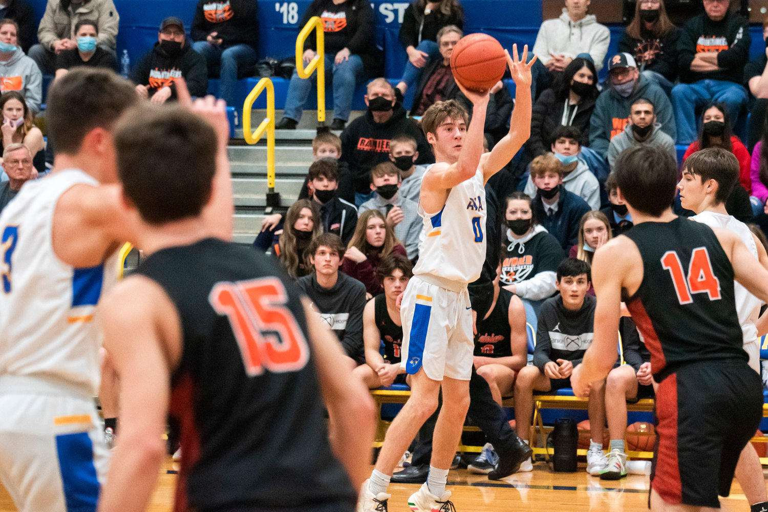 Adna’s Aaron Aselton (0) looks to shoot Friday night during a game against Rainier.
