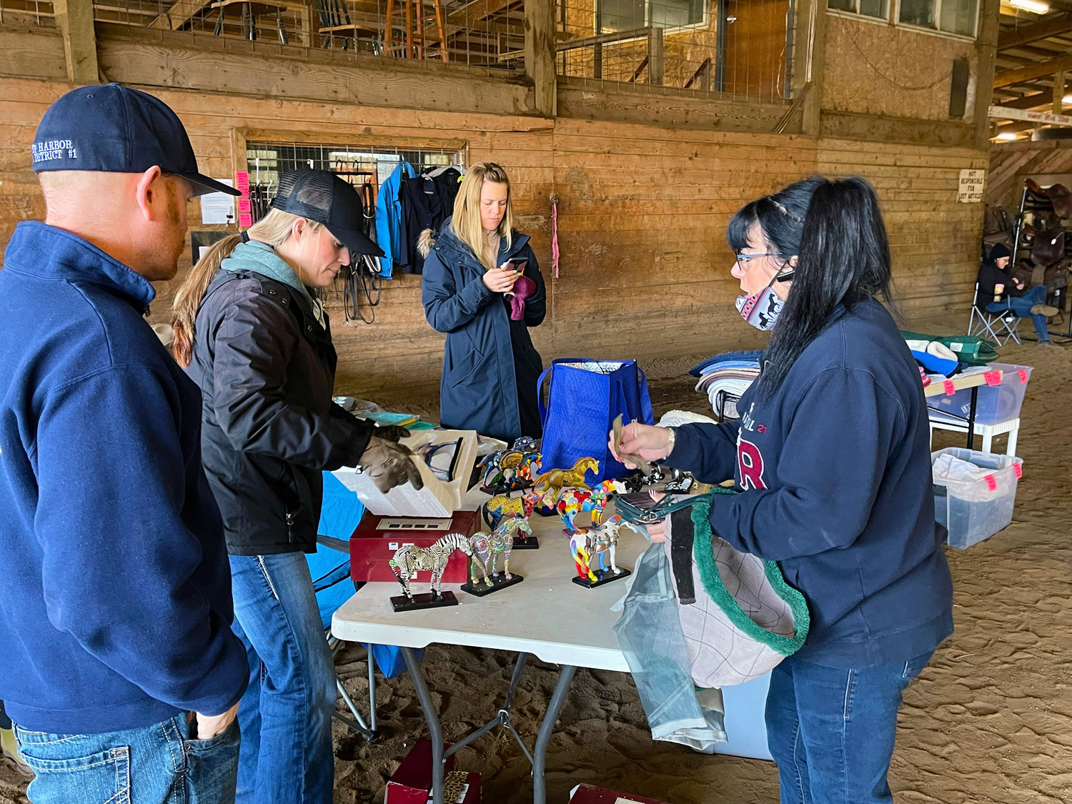 An area resident purchases Painted Ponies at the Rockin' M Ranch tack sale and swap meet.