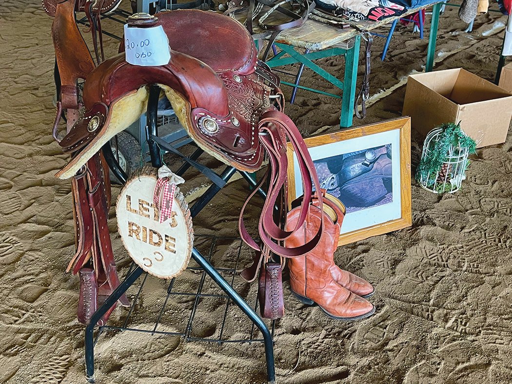 Horse supplies and equipment sits for sale at the Rockin' M Ranch tack sale and swap meet.
