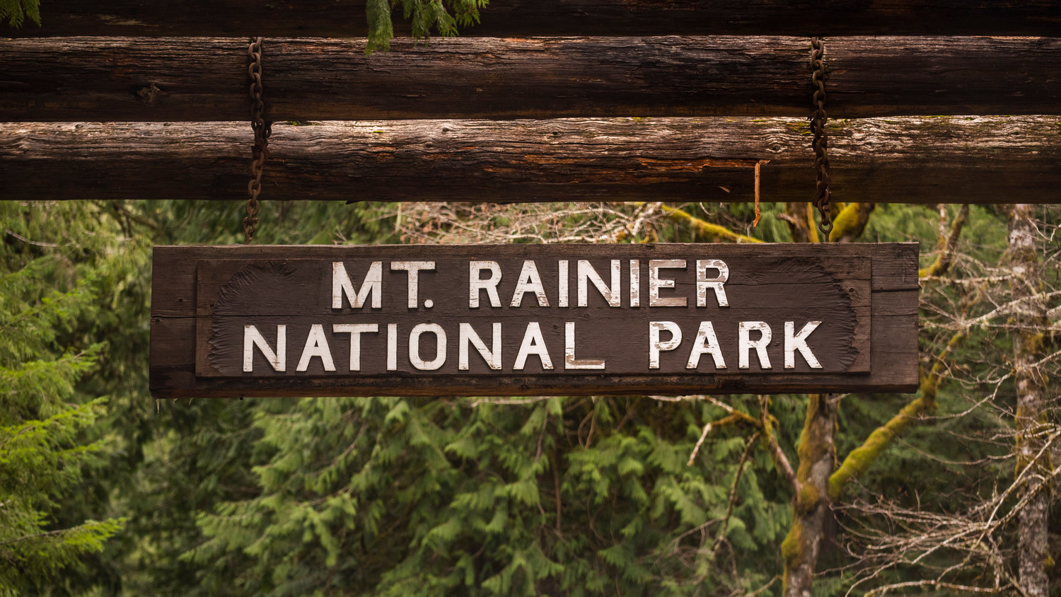 A sign hangs at the entrance to Mount Rainier National Park in Ashford on Thursday.