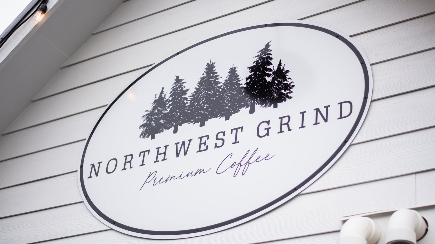 Signage for Northwest Grind hangs on display Tuesday morning.
