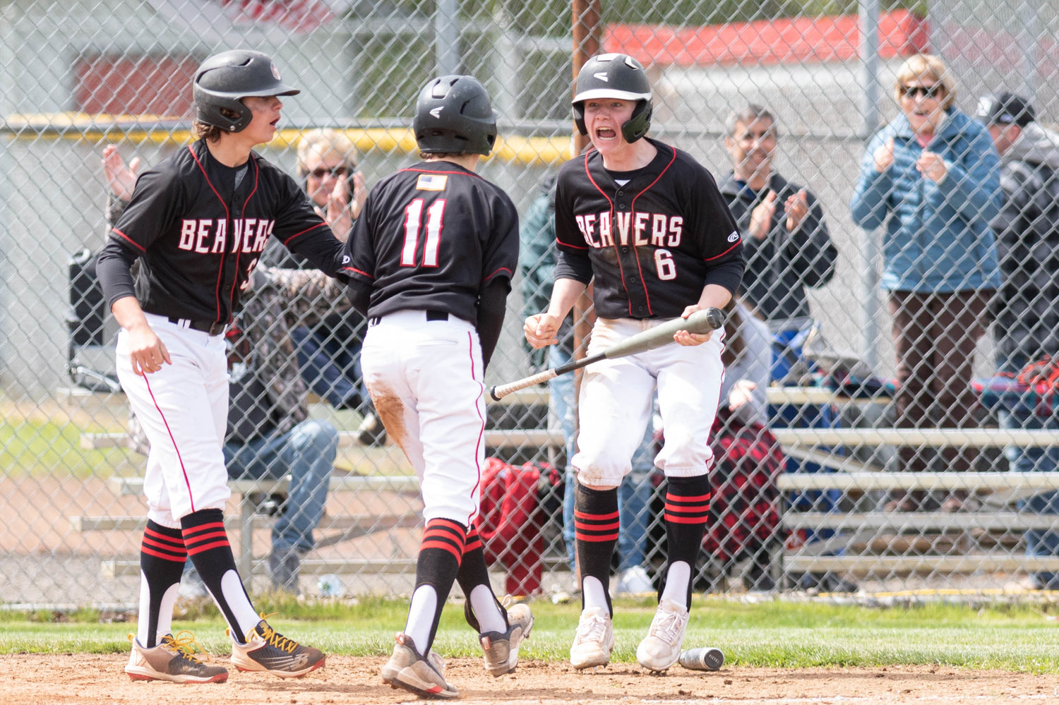 Tenino's Mikey Vassar (6) yells in celebration during the Beavers' 8-6, loser-out victory over Eatonville in the 1A District IV playoffs Friday in Castle Rock.