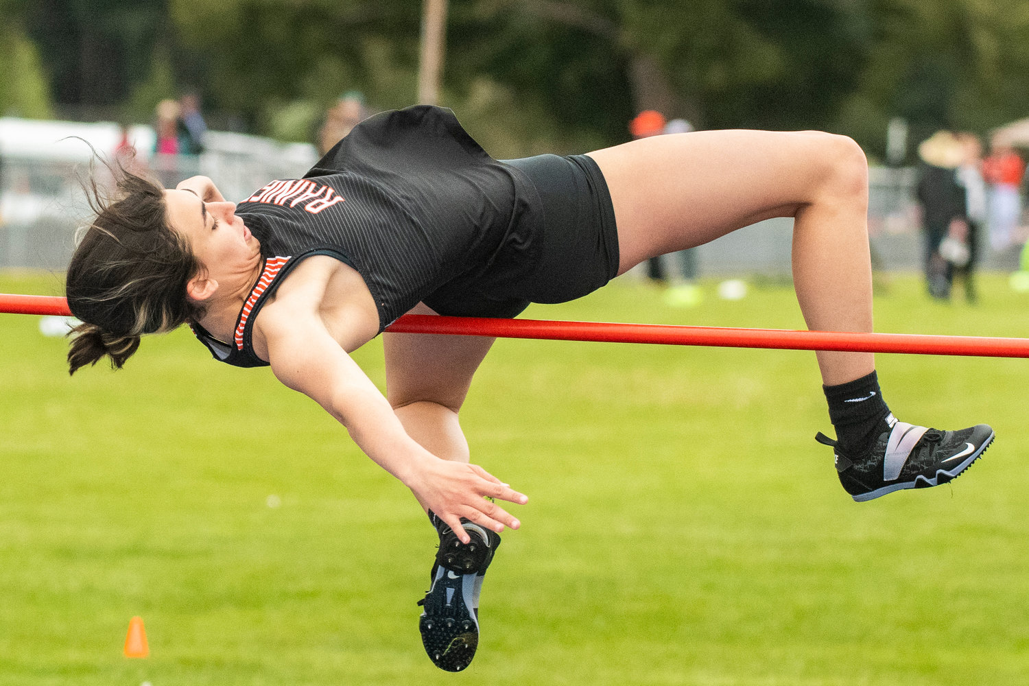 Rainier's Acacia Murphy leaps in the girls high jump during the Central 2B League Championships on May 13.