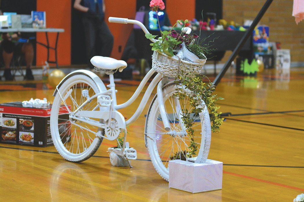 A white decorative bicycle was one of several items raffled off at the talent show in Rainier on May 14.