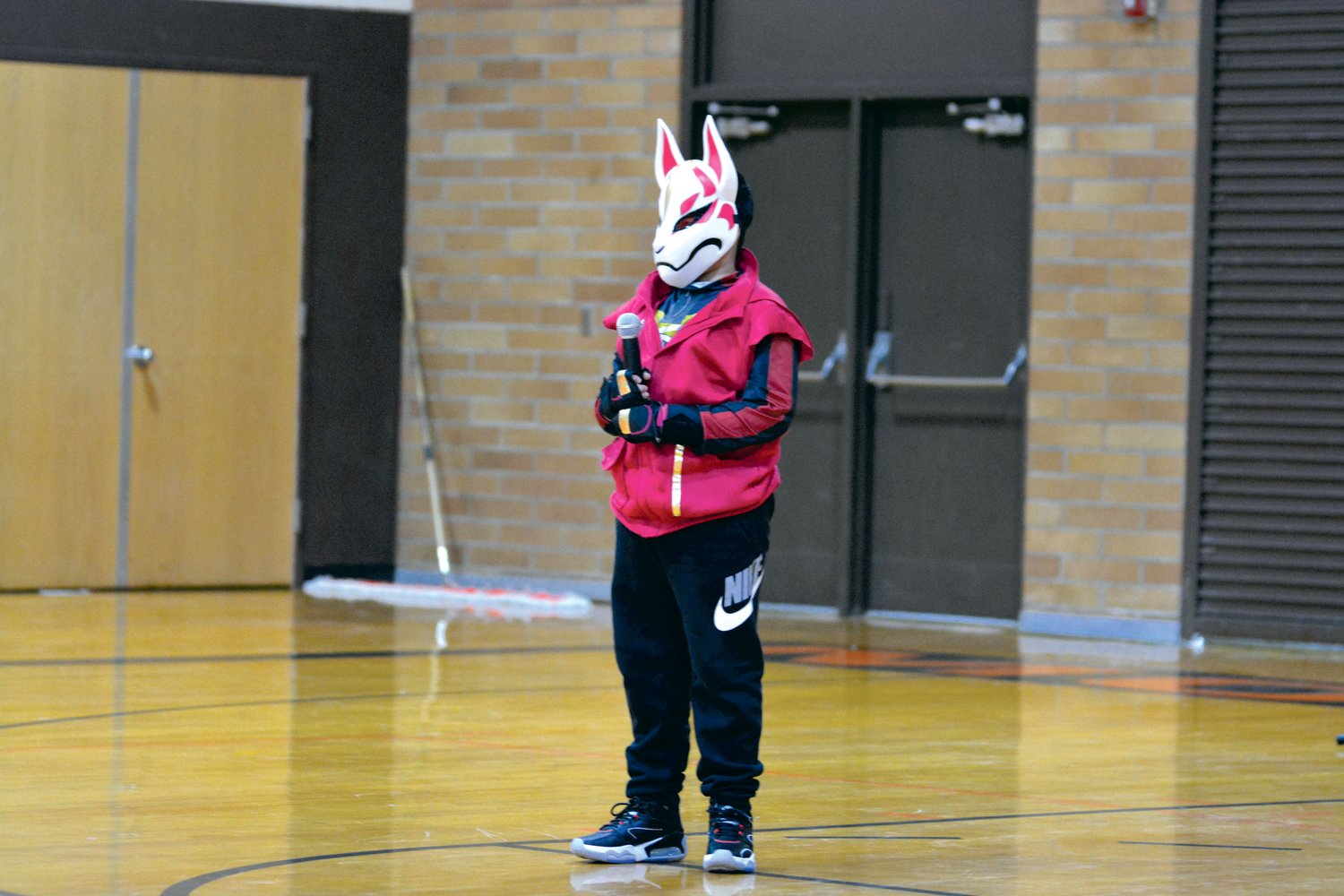 Gustavo Diaz performs a song parodying the popular video game Fortnite at the Rainier Community Talent Show on May 14.