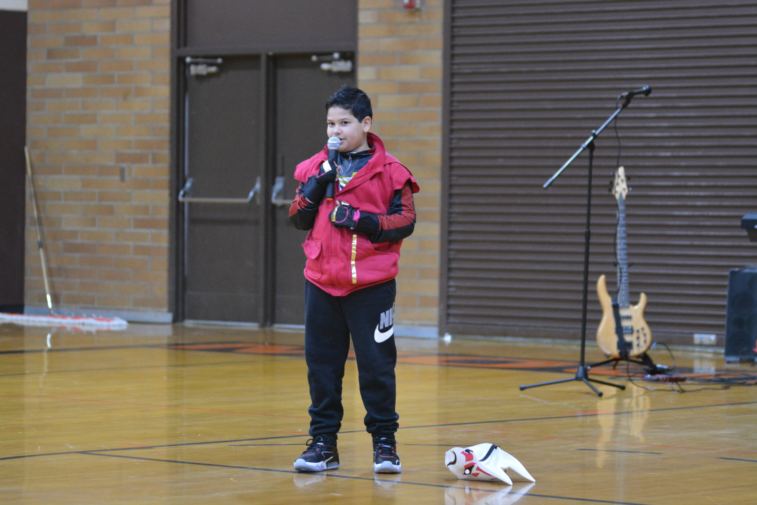Gustavo Diaz performs a song parodying the popular video game Fortnite at the Rainier Community Talent Show on May 14.