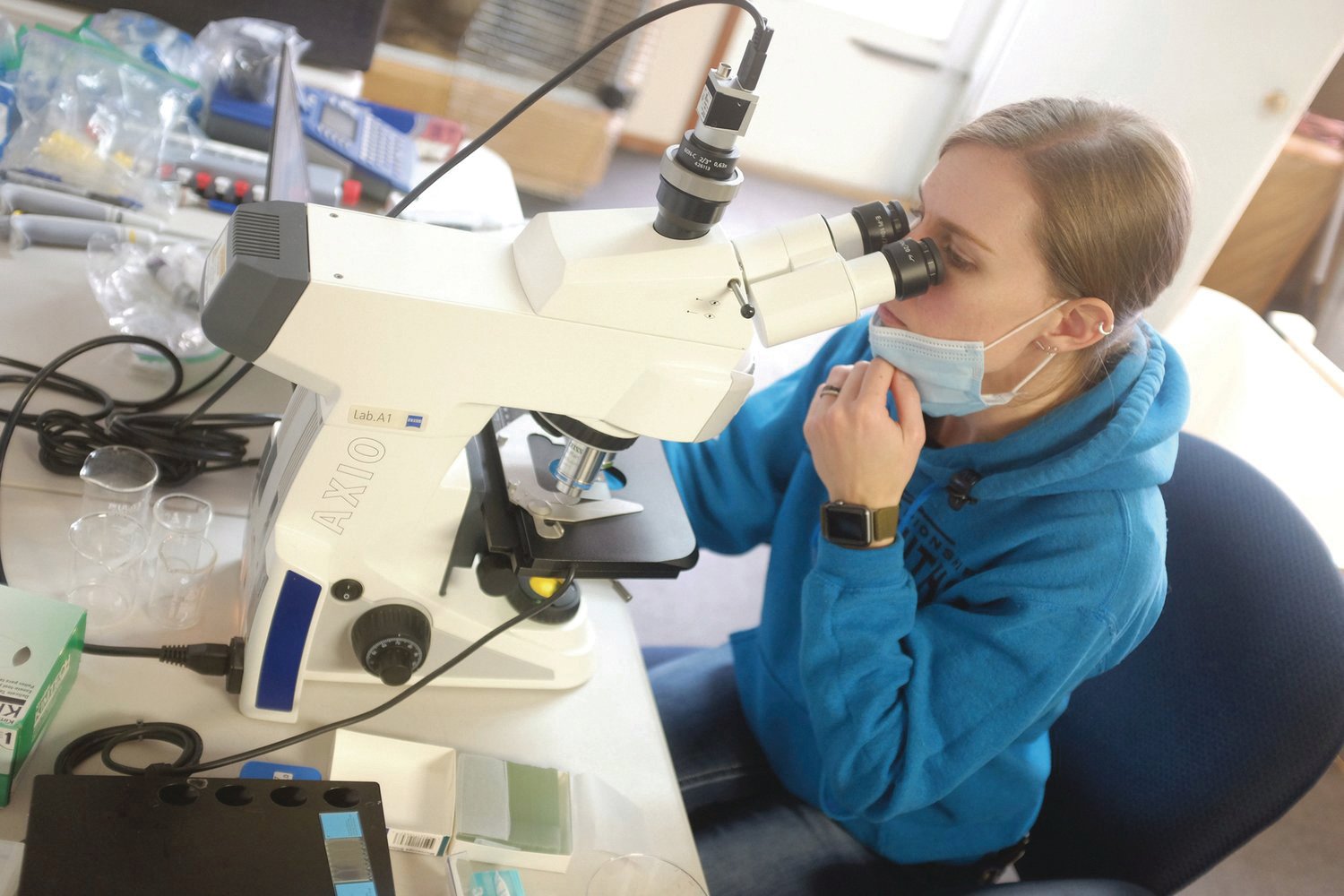 Maryann Cristler checks the samples for quality and quantity of sperm.