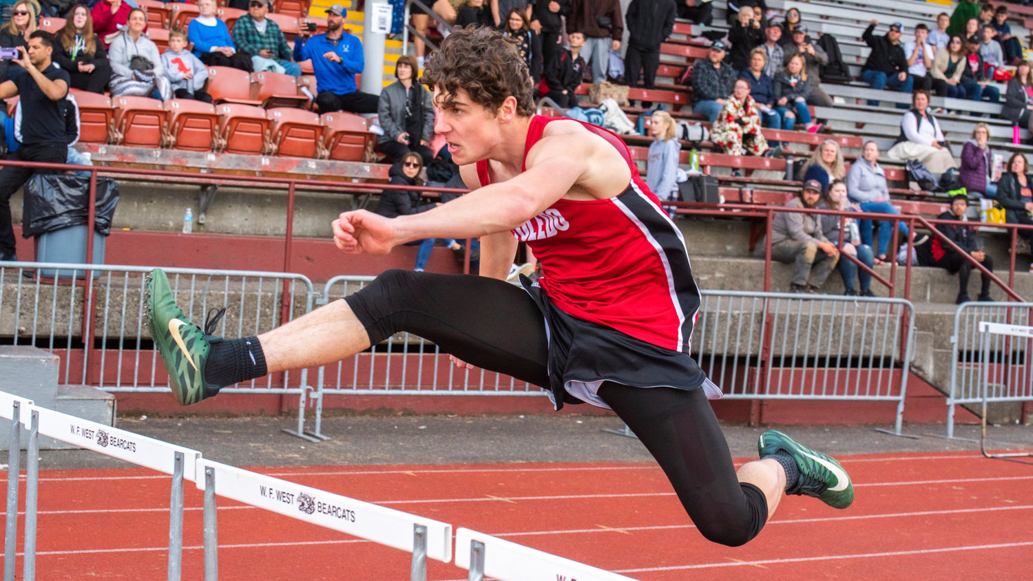A Toledo Riverhawk flies over hurdles at W.F. West High School in Chehalis on Friday.