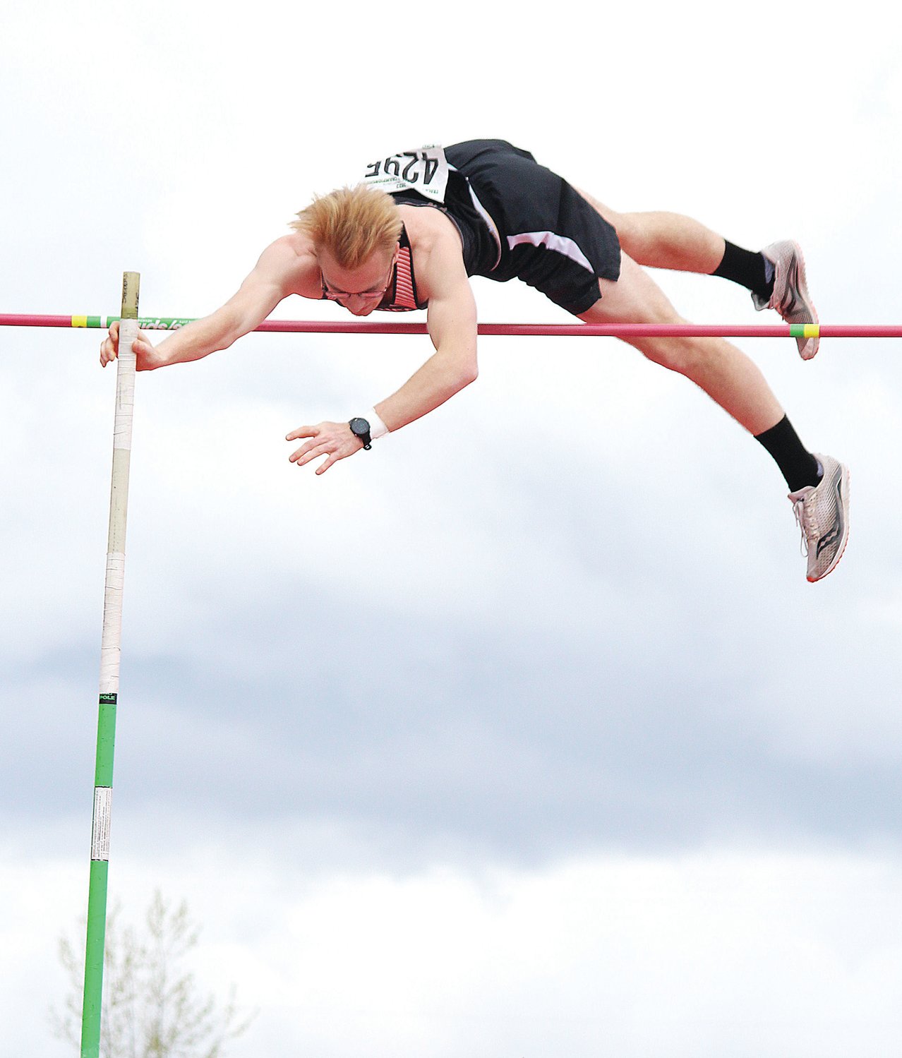 Rainier's Ryan Doidge clears the pole vault bar during the State 2B Boys Pole Vault Finals, which he won with a mark of 14-00.