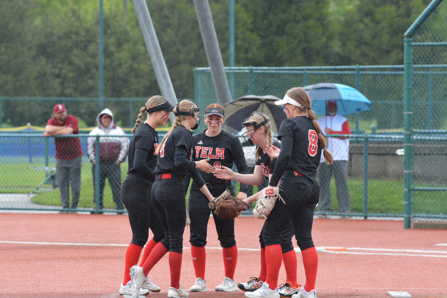 Freshman pitcher Jessika Jennings is greeted by the Tornados infield after retiring a batter against Cascade.