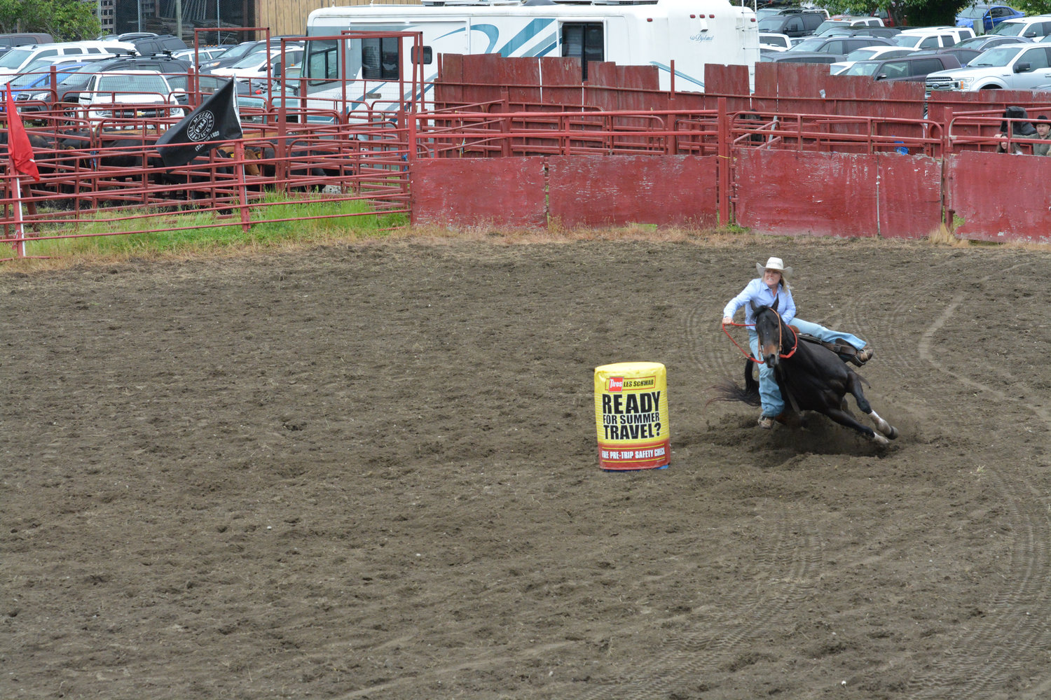 A cowgirl navigates her horse around a barrel during the barrel racing contest on June 4 in Roy.