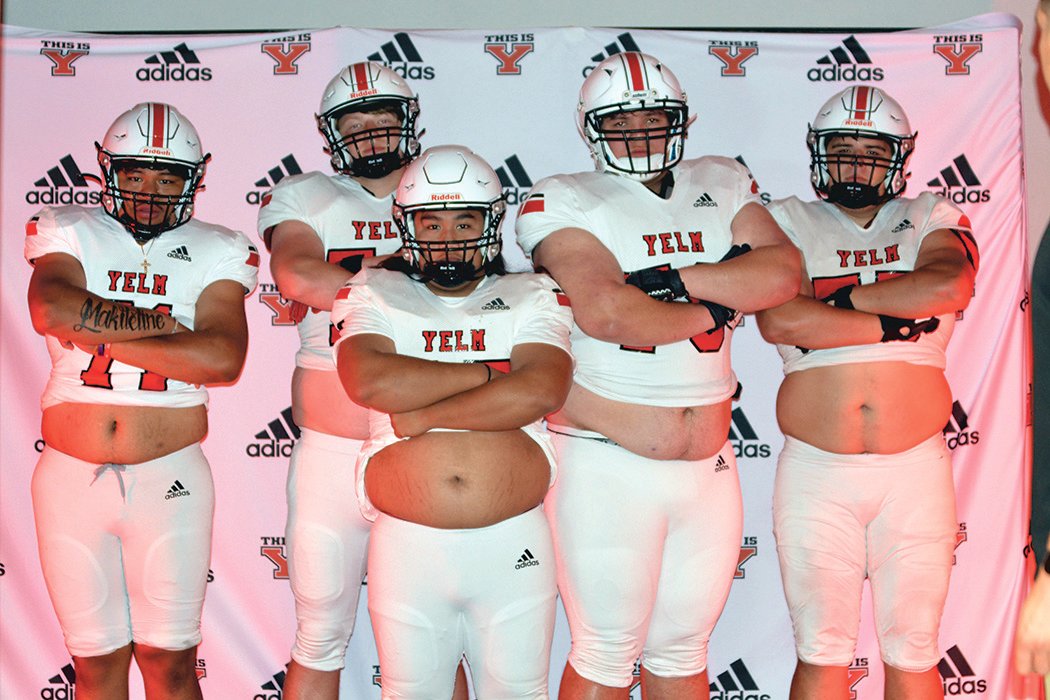 Members of the Yelm Tornados 2022 offensive line unit pose for a photo.