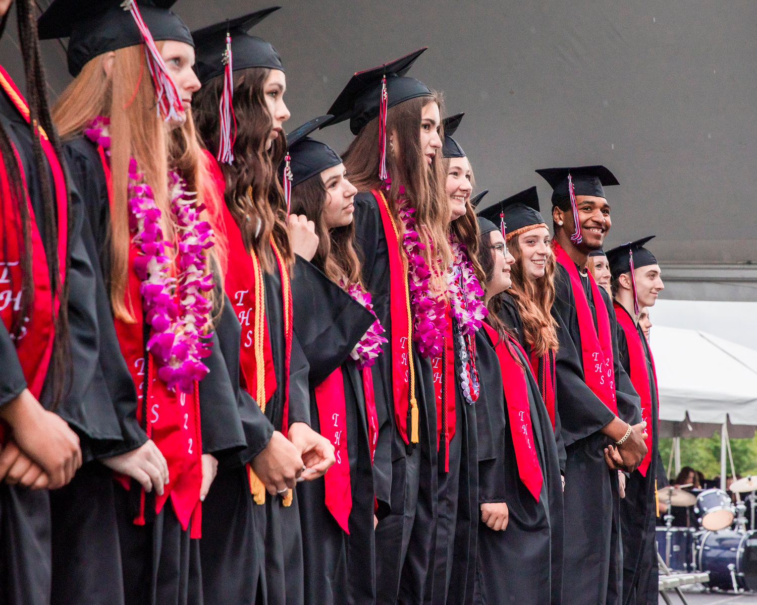 Graduates smile at the crowd during a graduation ceremony in Tenino.