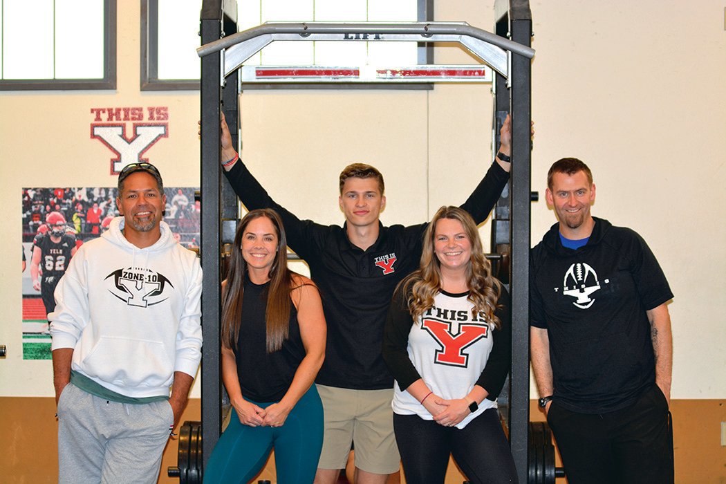 From left to right, Jason Ronquillo, Cayla Gable, Jacob Nolan, Kayla Richter and Thomas Hoghaug pose for a photo after their students at Yelm High School won a national championship in weightlifting.