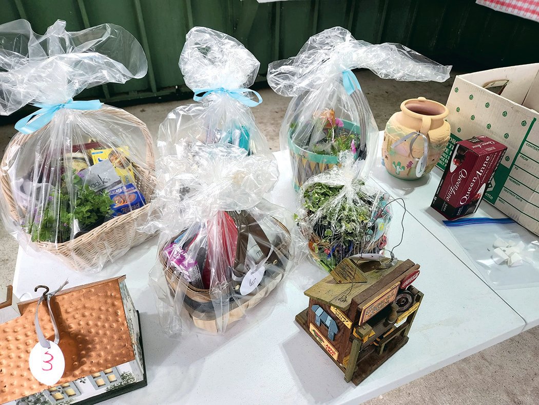 Several gift baskets were given out during a raffle at the June 18 alumni picnic in Roy.