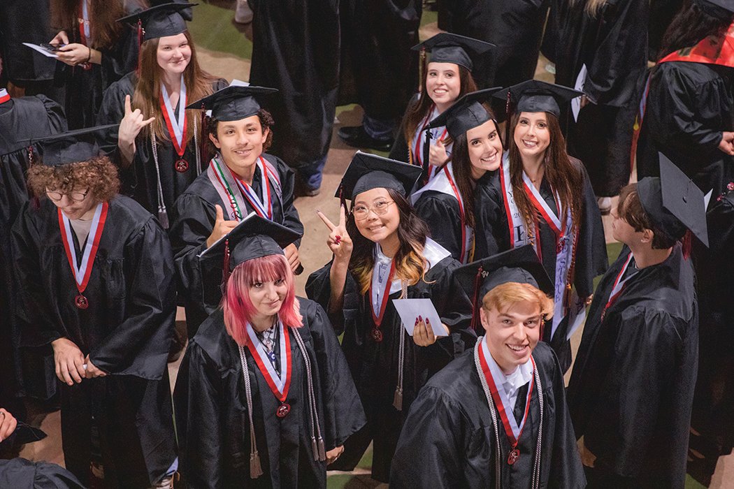 A group of Yelm High School graduates smile for a photo at the Tacoma Dome on June 16.