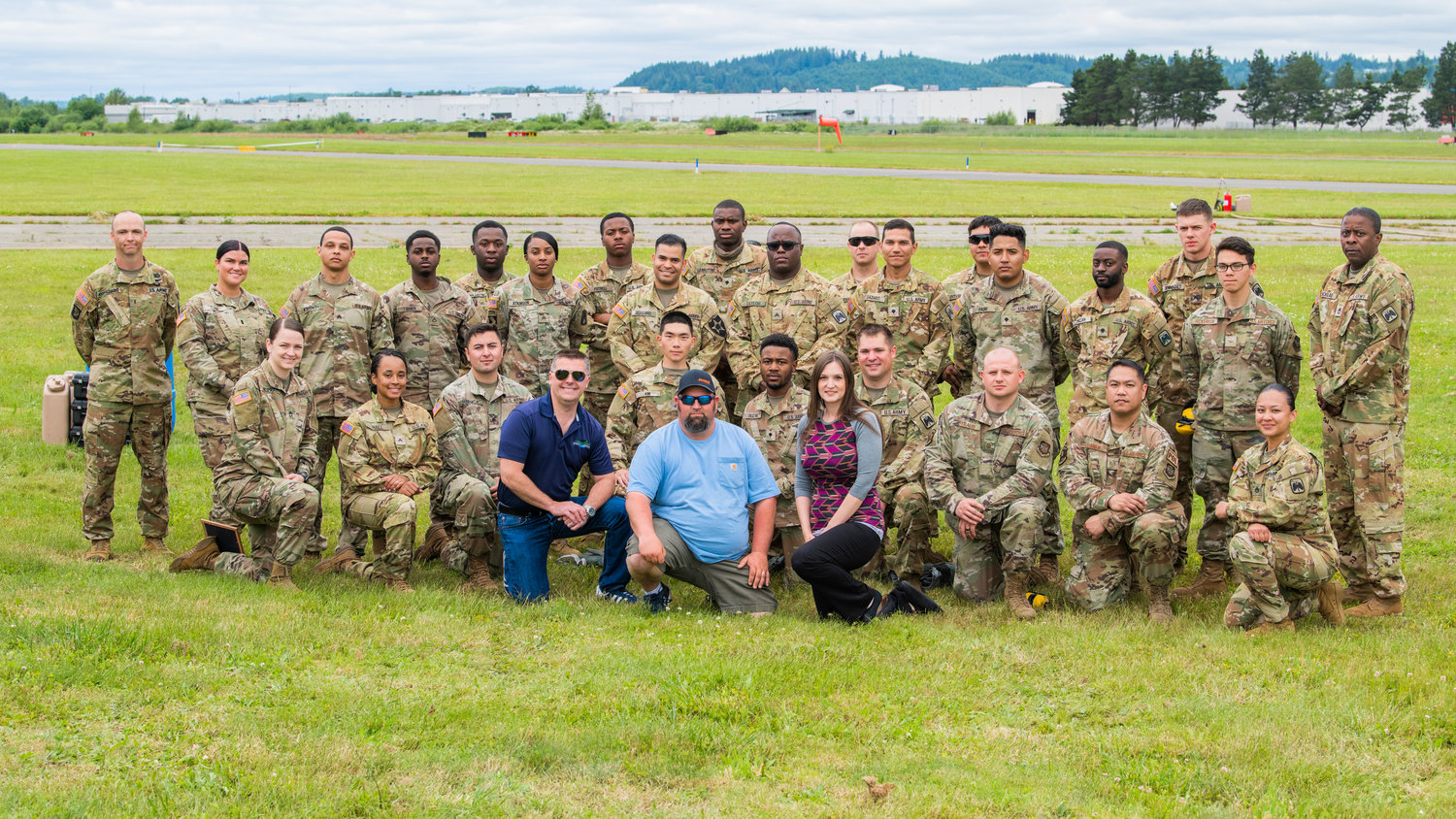 Staff from the Chehalis-Centralia Airport pose for a photo with members of the United States Army and Airforce from Joint Base Lewis-McChord during a military training exercise on Wednesday, June 22 in Chehalis.