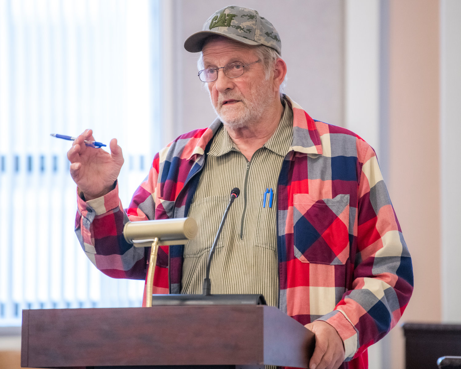 Mineral resident Ron Nilson speaks in opposition of a rezone on YMCA property north of Mineral Lake during public comment at a Lewis County Planning Commission meeting Tuesday night.