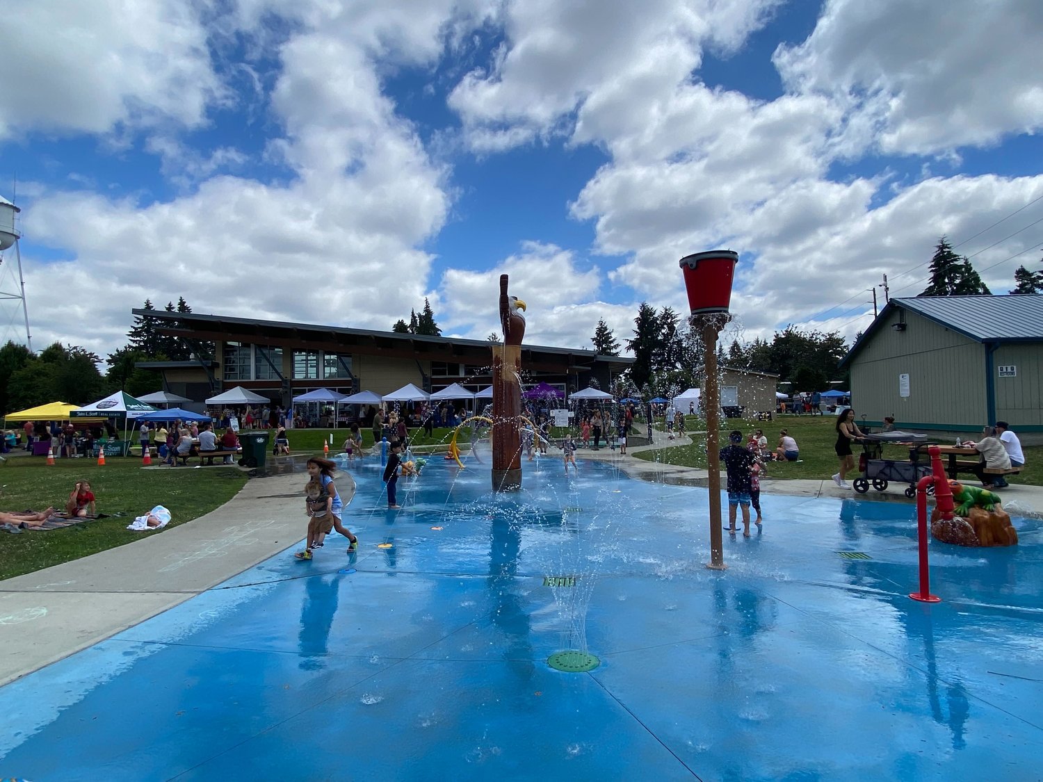 Kids play at the splash pad at Yelm City Park on Saturday, July 23. Thurston County declared a hazardous weather event on Monday in anticipation of warm weather.