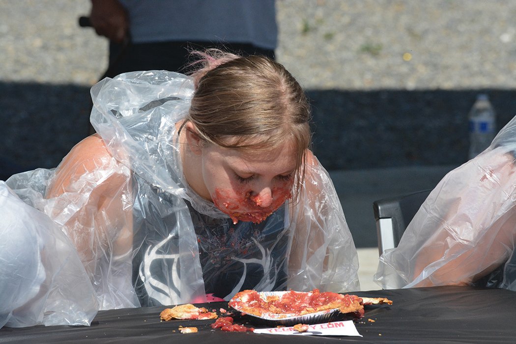 Kaeley Schultz participates in the pie eating contest at the Nisqually Valley Barbecue Rally on July 23.