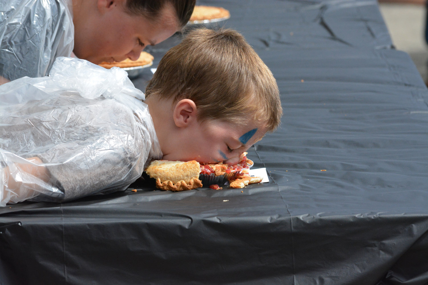 Carson Sloan, 4, chows down on a cherry pie at the pie eating competition at the Nisqually Valley Barbecue Rally on July 23.