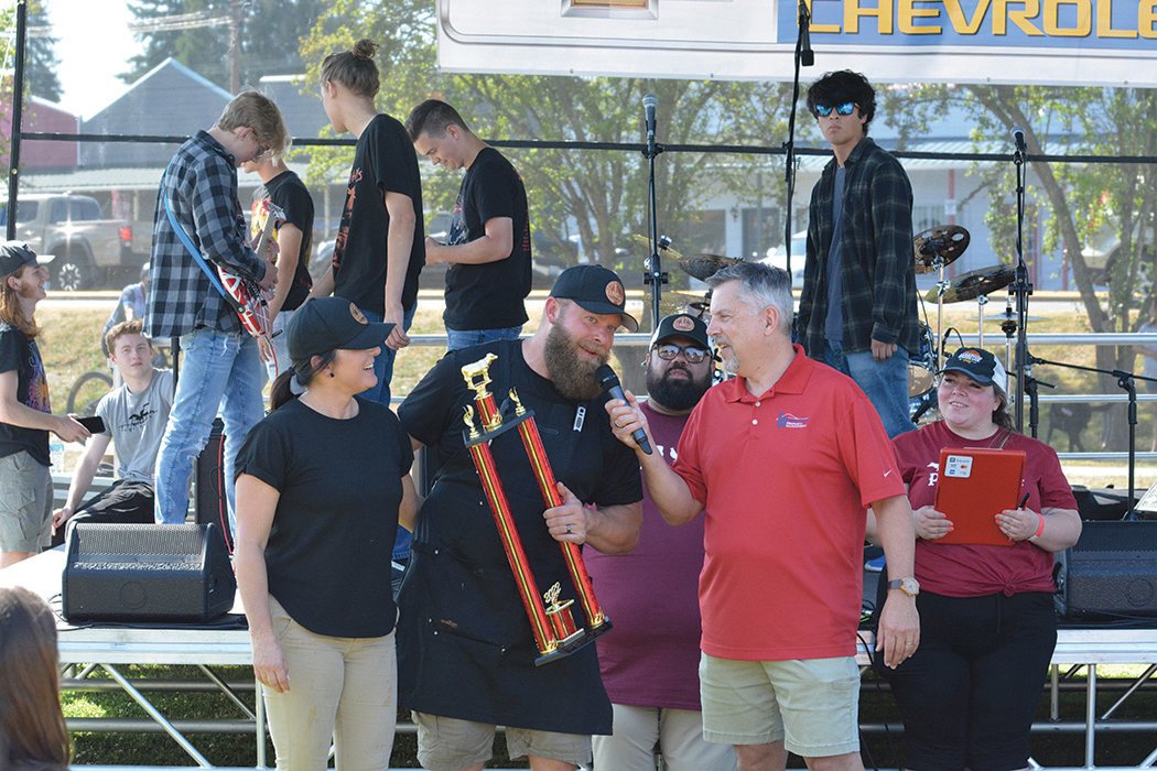Steele Clayton gives an acceptance speech after Steele Barrel Barbecue won the People’s Choice award on July 23 at the Nisqually Valley Barbecue Rally.