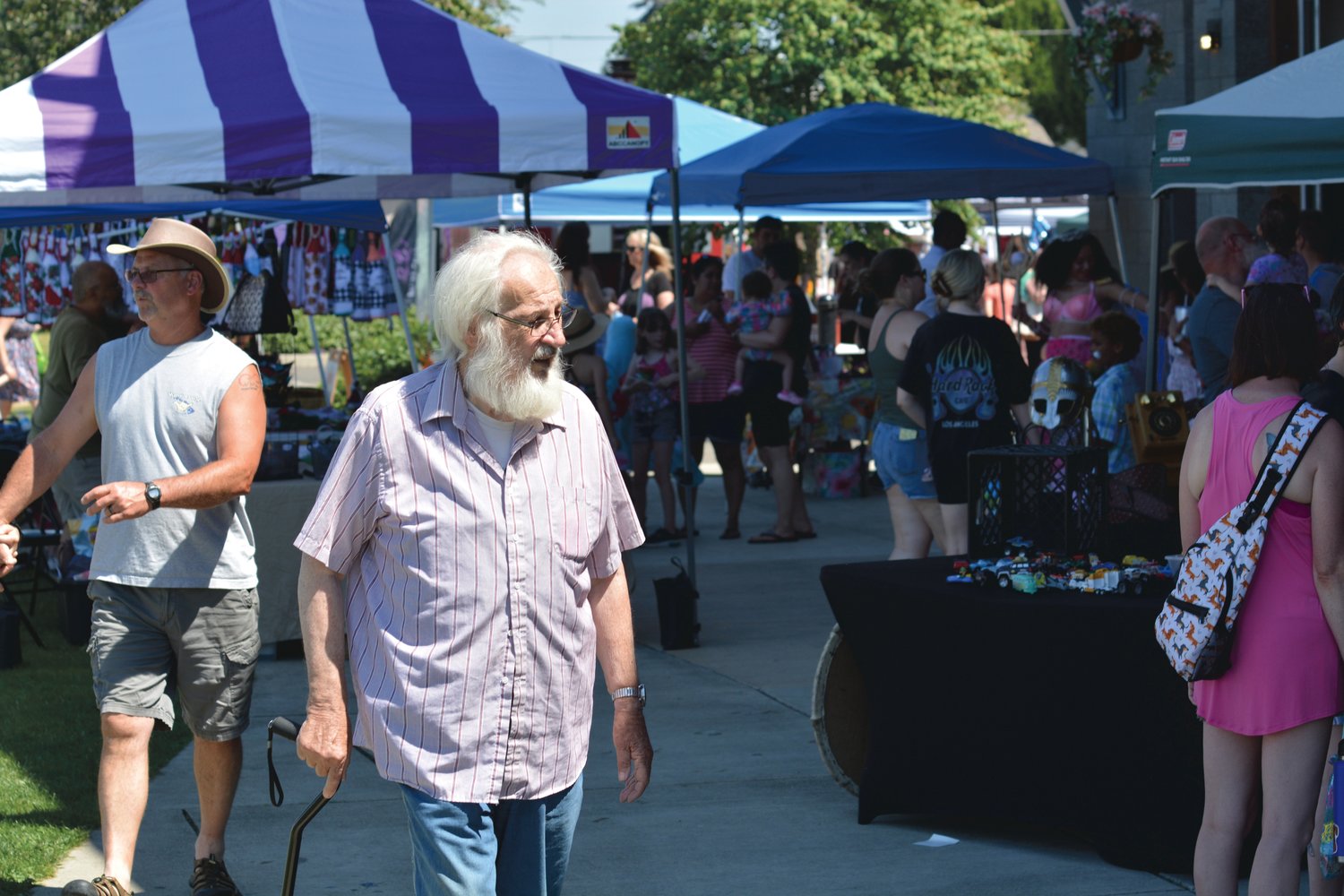 Attendees of the Mermaid Fest at Yelm City Park stroll through a variety of vendors who set up shop at Yelm City Park on Saturday, July 30.