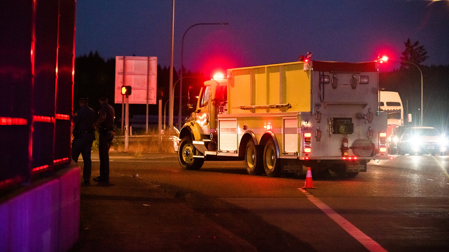 Firetrucks respond to a fire on the exit 88 off-ramp from Interstate 5 Thursday night in Grand Mound.