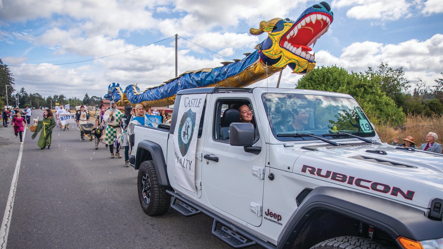 A dragon soars above the Castle Reality float Saturday in Rainier during the Round Up Days parade.