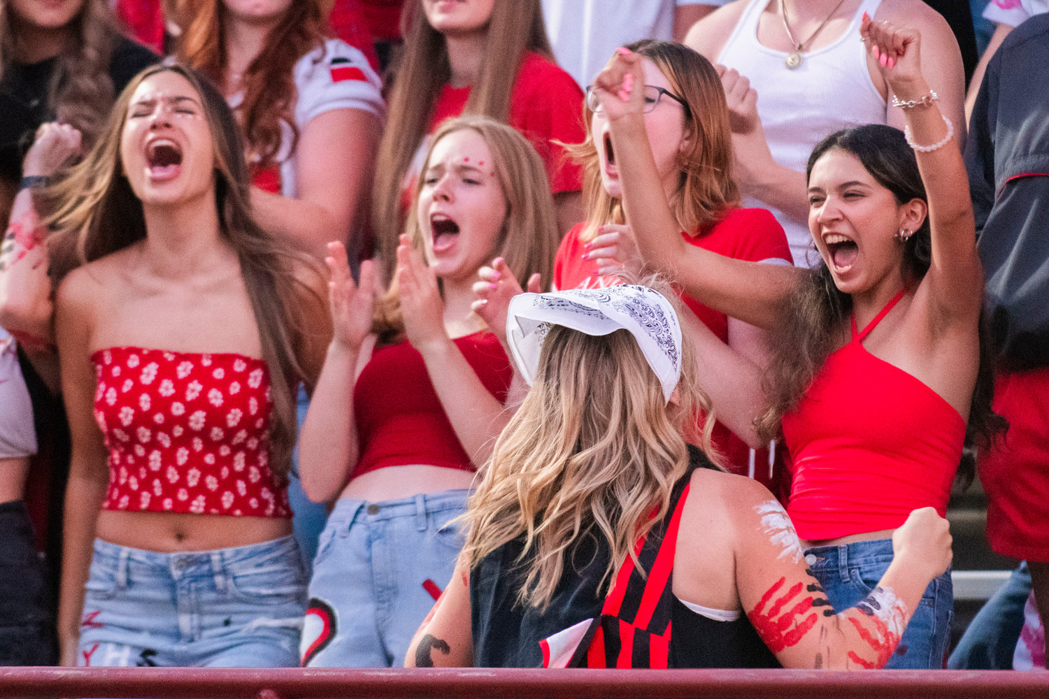 Yelm High School fans cheer for the Tornados under Friday night lights.